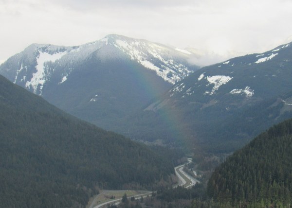 View of mountains, freeway and rainbow.