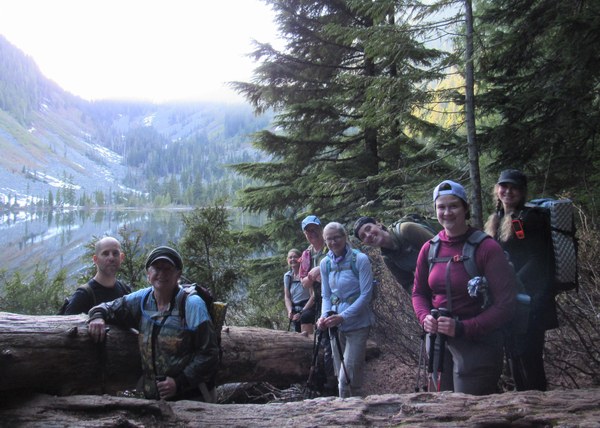 group  of hikers at alpine lake.
