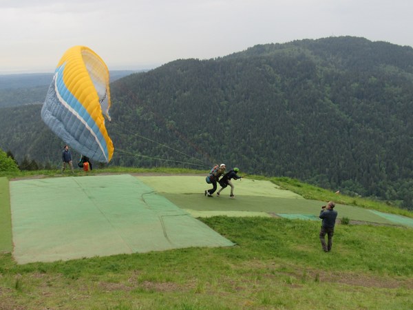 Two paragliders and photographer