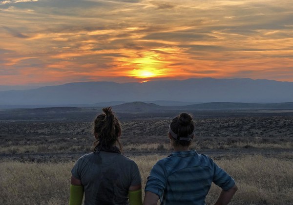 Colors updated - Hiking partners enjoy a sunset together at the end of a long day p23.jpg