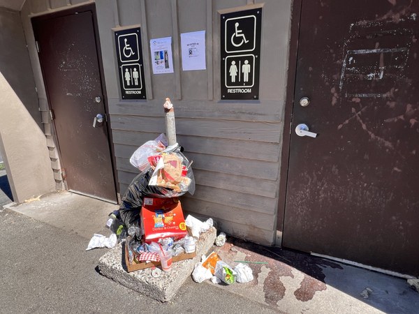 Excess trash outside a vault toilet in the Chinook Pass area. Photo by Jan Bird.Photo by Jan Bird..JPG
