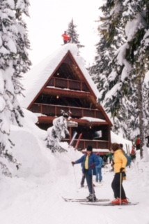 John Hansen skiing on the roof of Stevens Lodge (front)