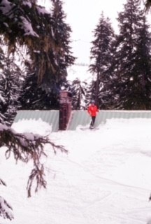John Hansen skiing on the roof of Stevens Lodge (side)
